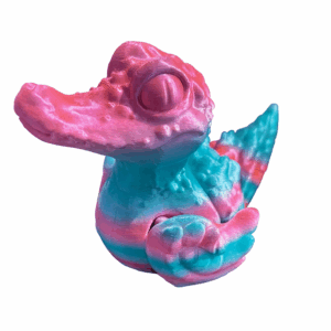 3D-printed Crocodile Duck figurine made with tri-colored silk filament in shades of pink, teal, and white, featuring articulated wings and a playful fantasy design.