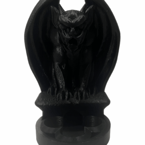 Black 3D-printed gargoyle dice tower with wings wrapped forward, used for DnD and tabletop RPG dice rolling