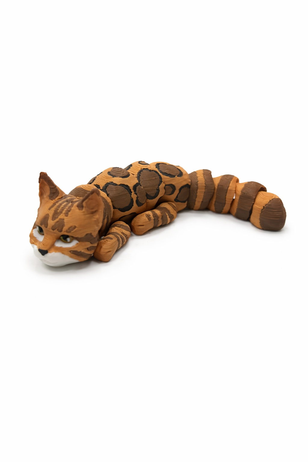 Side view of articulated cat figurine highlighting movable body segments